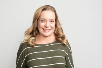 Alexis N. Crawford, Maine-based founder of On Point Digital and HubSpot specialist, smiling in a studio portrait.